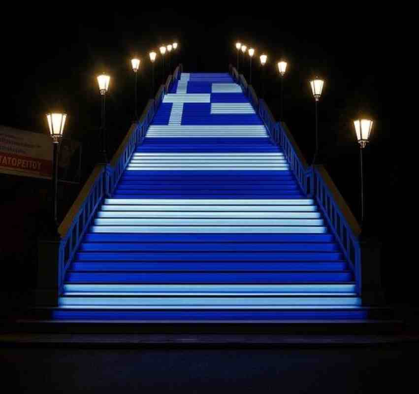 Πάτρα γαλανόλευκα, Patras blue and white, Πατρινά κτίρια φωτισμός, Patras buildings lighting, Εθνικές γιορτές Πάτρα, Greek National Holidays Patras, Βασίλης Μαυρομύτης AI, Vasilis Mavromytis AI, Τεχνητή Νοημοσύνη πόλη, Artificial Intelligence city, AI Patras φαντασία, AI Patras vision, Ελληνική σημαία φωτισμός, Greek flag lighting, SEO keywords, λέξεις κλειδιά εφημερίδας,