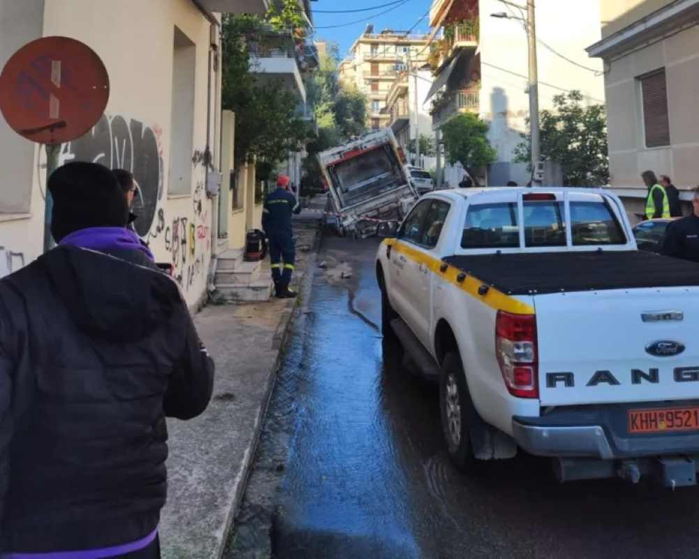 Πάτρα, Patras, καθίζηση οδοστρώματος, road collapse, οδός Αλσυλίου, Alsiliou street, Δασύλλιο, Dasilio, απορριμματοφόρο, garbage truck accident, ΔΕΥΑΠ, DEYAP, διαρροή νερού, water leak, πλημμύρα υπογείου, basement flood, οδός Κανακάρη, Kanakari street, υποδομές Πάτρας, Patras infrastructure, καθίζηση δρόμου, road subsidence, kathizisi Patra, odos Alsiliou, odos Kanakari, αποζημιώσεις, damages compensation, τεχνικά έργα, public works, κίνδυνος στους δρόμους, road safety Patras, αυτοδιοίκηση, Patras municipality,